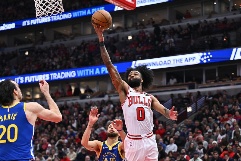 CHICAGO, ILLINOIS - JANUARY 12:  Coby White #0 of the Chicago Bulls attempts a lay up in the first half against the Golden State Warriors on January 12, 2024 at United Center in Chicago, Illinois.   NOTE TO USER: User expressly acknowledges and agrees that, by downloading and or using this photograph, User is consenting to the terms and conditions of the Getty Images License Agreement.  (Photo by Jamie Sabau/Getty Images)