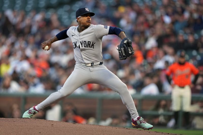 May 31, 2024; San Francisco, California, USA; New York Yankees starting pitcher Marcus Stroman (0) throws a pitch against the San Francisco Giants during the first inning at Oracle Park. Mandatory Credit: Darren Yamashita-USA TODAY Sports