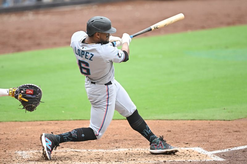May 28, 2025; San Diego, California, USA; Miami Marlins second baseman Otto Lopez (6) hits a three-run home run during the fifth inning against the San Diego Padres at Petco Park. Mandatory Credit: Denis Poroy-Imagn Images