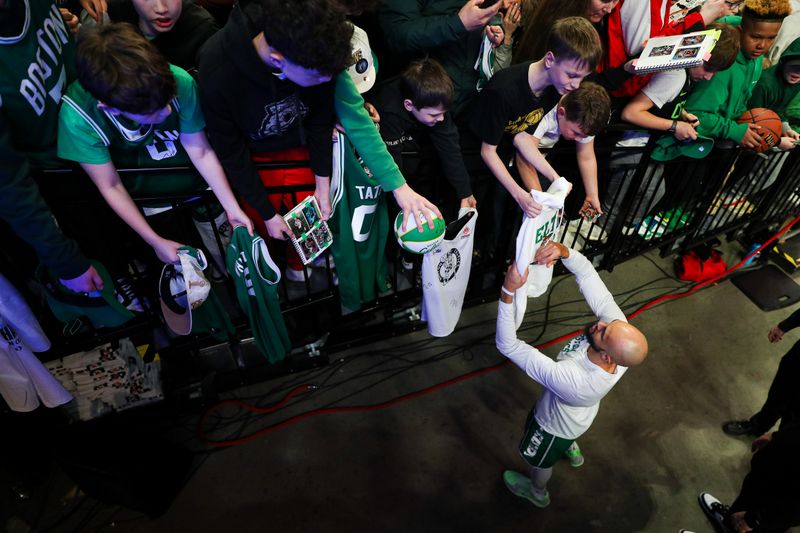 PORTLAND, OREGON - MARCH 23: Derrick White #9 of the Boston Celtics signs autographs for fans before a game against the Portland Trail Blazers at Moda Center on March 23, 2025 in Portland, Oregon. NOTE TO USER: User expressly acknowledges and agrees that, by downloading and or using this photograph, User is consenting to the terms and conditions of the Getty Images License Agreement. (Photo by Rio Giancarlo/Getty Images)