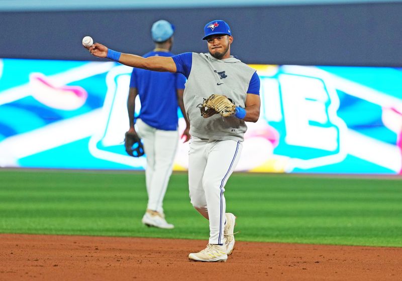 Aug 6, 2024; Toronto, Ontario, CAN; Toronto Blue Jays shortstop Leo Jimenez (49) throws a ball to first base during batting practice before a game against the Baltimore Orioles at Rogers Centre. Mandatory Credit: Nick Turchiaro-USA TODAY Sports