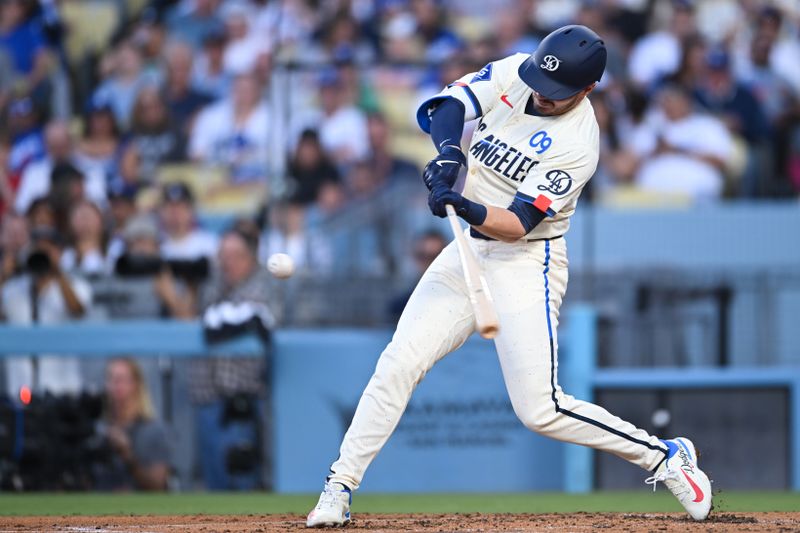 Jun 22, 2024; Los Angeles, California, USA; Los Angeles Dodgers second baseman Gavin Lux (9) hits a home run against the Los Angeles Angels during the third inning at Dodger Stadium. Mandatory Credit: Jonathan Hui-USA TODAY Sports