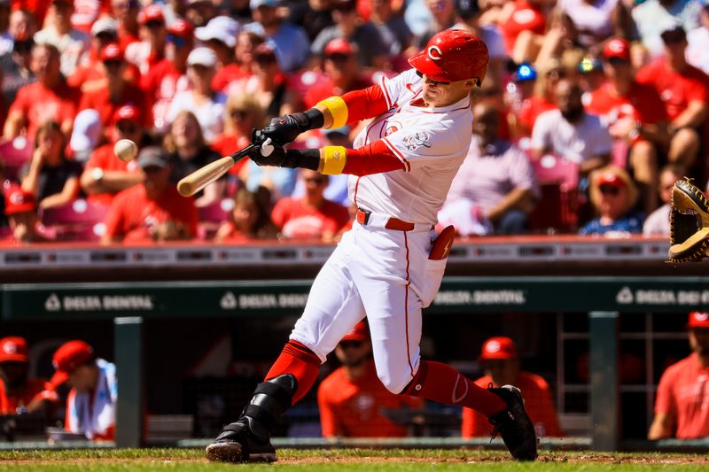 Sep 1, 2024; Cincinnati, Ohio, USA; Cincinnati Reds outfielder TJ Friedl (29) hits a single against the Milwaukee Brewers in the first inning at Great American Ball Park. Mandatory Credit: Katie Stratman-USA TODAY Sports