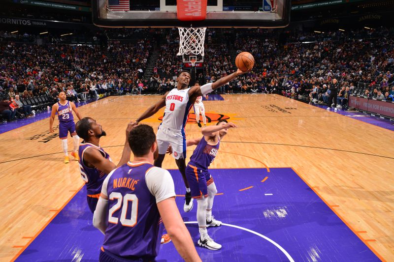 PHOENIX, AZ - FEBRUARY 14:  Jalen Duren #0 of the Detroit Pistons grabs a rebound during the game against the Phoenix Suns on February 14, 2024 at Footprint Center in Phoenix, Arizona. NOTE TO USER: User expressly acknowledges and agrees that, by downloading and or using this photograph, user is consenting to the terms and conditions of the Getty Images License Agreement. Mandatory Copyright Notice: Copyright 2024 NBAE (Photo by Barry Gossage/NBAE via Getty Images)