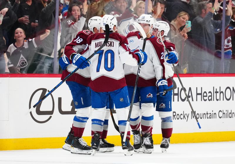 Dec 29, 2025; Denver, Colorado, USA; Colorado Avalanche center Jack Drury (18) (center) celebrates a goal scored with teammates n the first period against the Los Angeles Kings at Ball Arena. Mandatory Credit: Ron Chenoy-Imagn Images