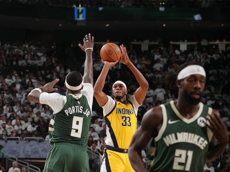 MILWAUKEE, WI - APRIL 23: Myles Turner #33 of the Indiana Pacers shoots the ball during the game against the Milwaukee Bucks during Round One Game Two of the 2024 NBA Playoffs on April 23, 2024 at the Fiserv Forum Center in Milwaukee, Wisconsin. NOTE TO USER: User expressly acknowledges and agrees that, by downloading and or using this Photograph, user is consenting to the terms and conditions of the Getty Images License Agreement. Mandatory Copyright Notice: Copyright 2024 NBAE (Photo by Gary Dineen/NBAE via Getty Images).