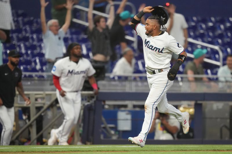 May 2, 2024; Miami, Florida, USA;  Miami Marlins second baseman Luis Arraez (3) rounds third base and scores the winning run in the tenth inning against the Colorado Rockies at loanDepot Park. Mandatory Credit: Jim Rassol-USA TODAY Sports