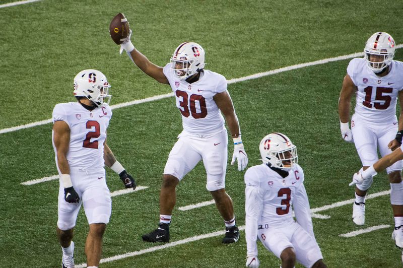 Nov 7, 2020; Eugene, Oregon, USA; Stanford Cardinal linebacker Levani Damuni (30) celebrates after intercepting a pass during the first half against the Oregon Ducks at Autzen Stadium. Mandatory Credit: Troy Wayrynen-USA TODAY Sports