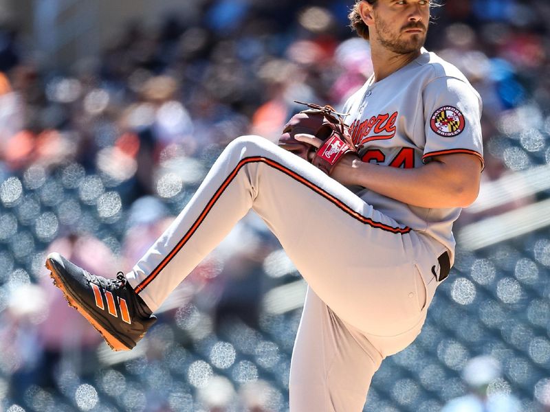 May 8, 2025; Minneapolis, Minnesota, USA; Baltimore Orioles starting pitcher Dean Kremer (64) delivers a pitch against the Minnesota Twins during the first inning at Target Field. Mandatory Credit: Matt Krohn-Imagn Images