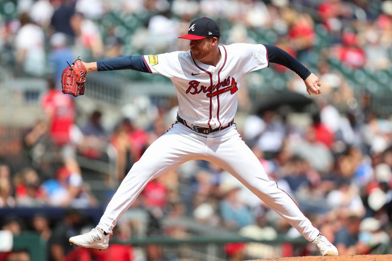 Aug 4, 2024; Cumberland, Georgia, USA; Atlanta Braves relief pitcher Aaron Bummer (49) pitches during a game against the Miami Marlins in the eight inning at Truist Park. Mandatory Credit: Mady Mertens-USA TODAY Sports