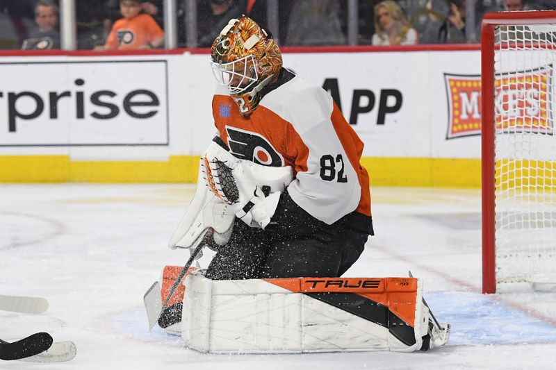 Mar 4, 2025; Philadelphia, Pennsylvania, USA; Philadelphia Flyers goaltender Ivan Fedotov (82) makes a save against the Calgary Flames during the second period at Wells Fargo Center. Mandatory Credit: Eric Hartline-Imagn Images