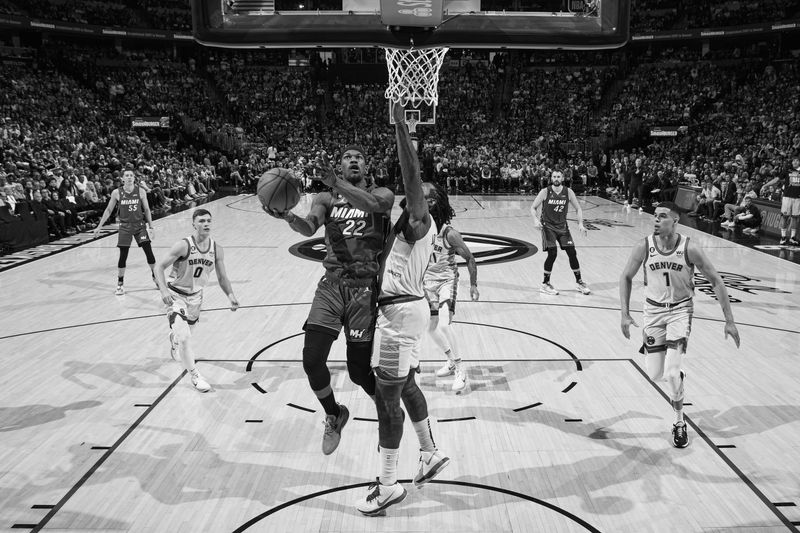 DENVER, CO - JUNE 12: (EDITORS NOTE: this photo has been converted to black and white) Jimmy Butler #22 of the Miami Heat drives to the basket during the game against the Denver Nuggets during Game Five of the 2023 NBA Finals on June 12, 2023 at Ball Arena in Denver, Colorado. NOTE TO USER: User expressly acknowledges and agrees that, by downloading and or using this Photograph, user is consenting to the terms and conditions of the Getty Images License Agreement. Mandatory Copyright Notice: Copyright 2023 NBAE (Photo by Garrett Ellwood/NBAE via Getty Images)