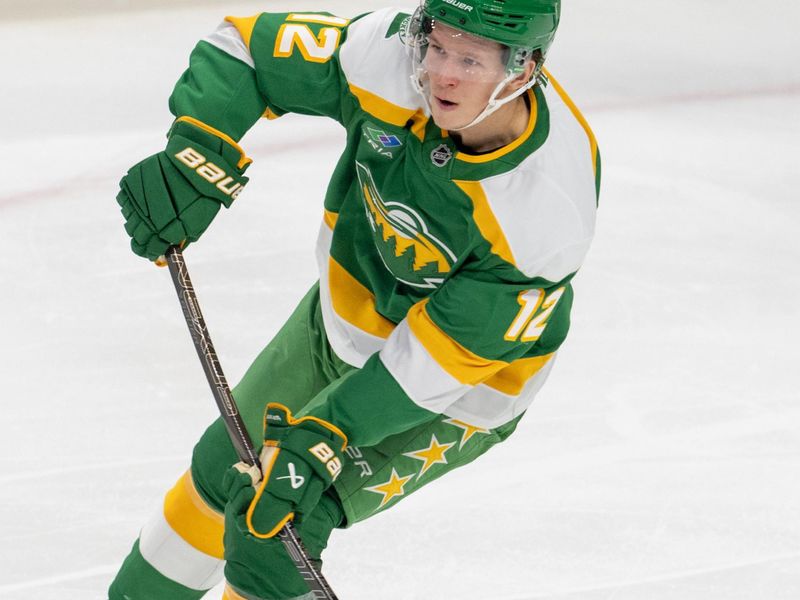 Dec 31, 2024; Saint Paul, Minnesota, USA; Minnesota Wild left wing Matt Boldy (12) passes in the second period against the Nashville Predators at Xcel Energy Center. Mandatory Credit: Matt Blewett-Imagn Images