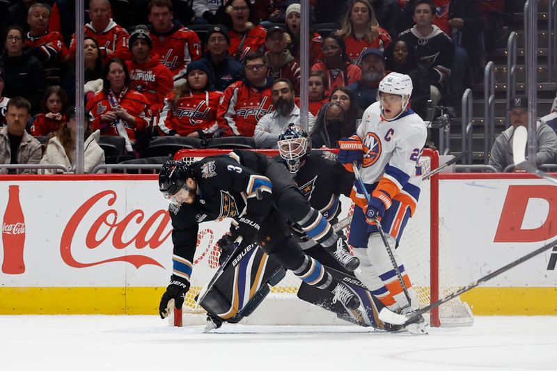 Nov 29, 2024; Washington, District of Columbia, USA; Washington Capitals defenseman Matt Roy (3) blocks a shot in front of New York Islanders left wing Anders Lee (27) and Capitals goaltender Logan Thompson (48) in the third period at Capital One Arena. Mandatory Credit: Geoff Burke-Imagn Images
