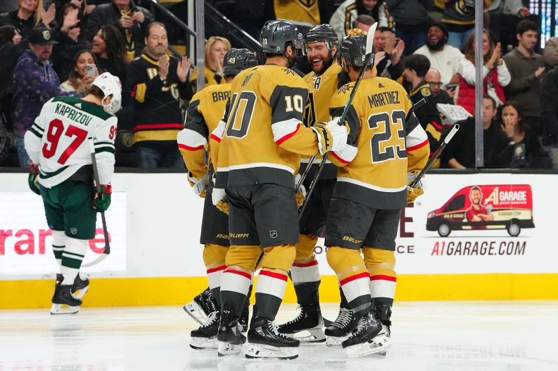 Feb 12, 2024; Las Vegas, Nevada, USA; Vegas Golden Knights right wing Jonathan Marchessault (81) celebrates with teammates after scoring a goal against the Minnesota Wild during the first period at T-Mobile Arena. Mandatory Credit: Stephen R. Sylvanie-USA TODAY Sports