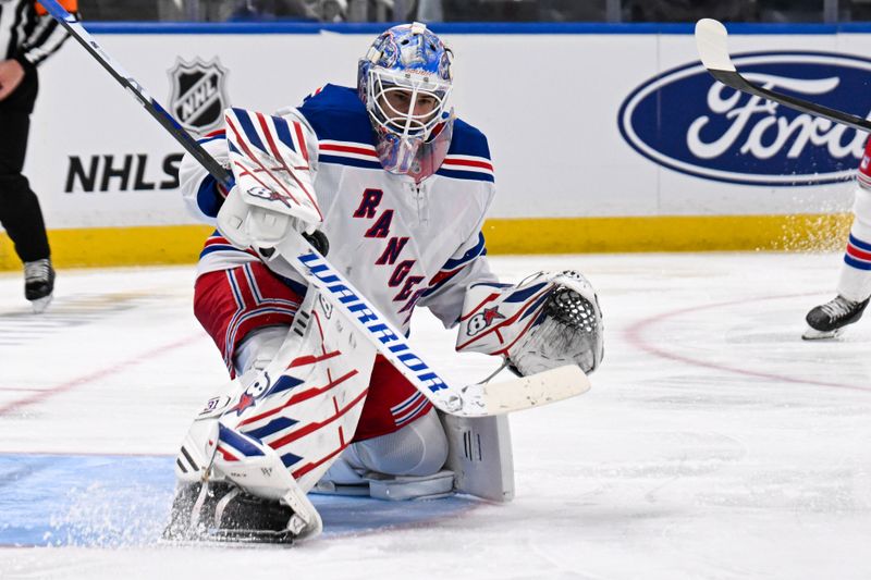 Apr 10, 2025; Elmont, New York, USA;  New York Rangers goaltender Igor Shesterkin (31) makes a save against the New York Islanders during the second period at UBS Arena. Mandatory Credit: Dennis Schneidler-Imagn Images