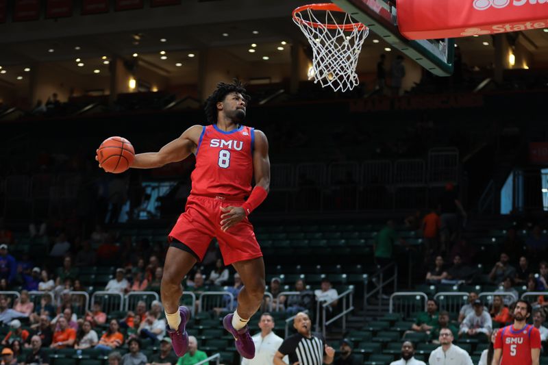 Jan 18, 2025; Coral Gables, Florida, USA; Southern Methodist Mustangs guard Kario Oquendo (8) dunks against the Miami Hurricanes during the second half at Watsco Center. Mandatory Credit: Sam Navarro-Imagn Images