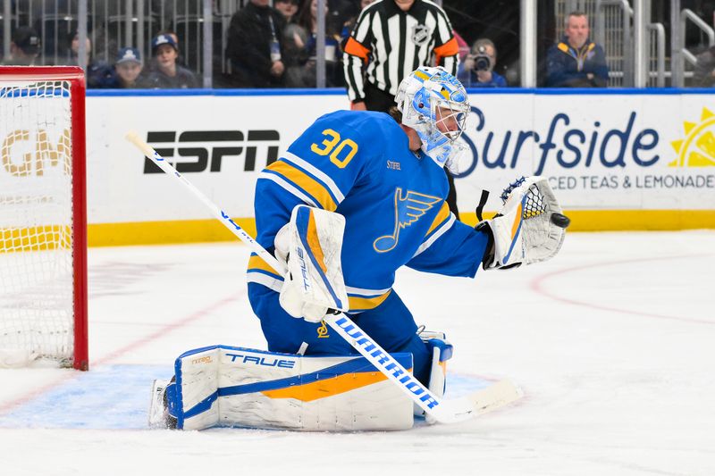 Mar 13, 2026; St. Louis, Missouri, USA; St. Louis Blues goaltender Joel Hofer (30) makes a glove save against the Edmonton Oilers during the first period at Enterprise Center. Mandatory Credit: Jeff Curry-Imagn Images