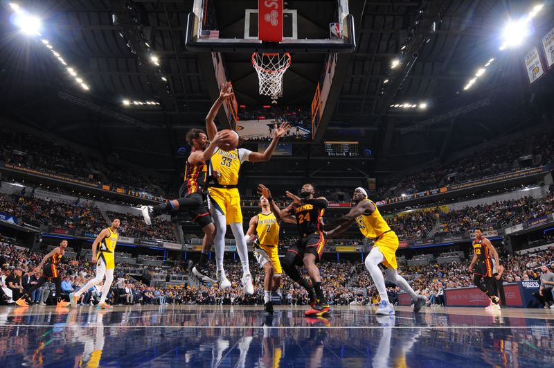 INDIANAPOLIS, IN - APRIL 14: Trae Young #11 of the Atlanta Hawks passes the ball during the game against the Indiana Pacers on April 14, 2024 at Gainbridge Fieldhouse in Indianapolis, Indiana. NOTE TO USER: User expressly acknowledges and agrees that, by downloading and or using this Photograph, user is consenting to the terms and conditions of the Getty Images License Agreement. Mandatory Copyright Notice: Copyright 2024 NBAE (Photo by Ron Hoskins/NBAE via Getty Images)