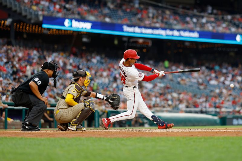 Jul 23, 2024; Washington, District of Columbia, USA; Washington Nationals third baseman Trey Lipscomb (38) doubles against the San Diego Padres during the third inning at Nationals Park. Mandatory Credit: Geoff Burke-USA TODAY Sports