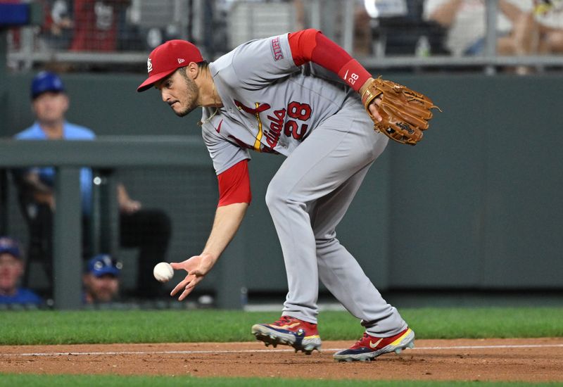Aug 12, 2023; Kansas City, Missouri, USA;  St. Louis Cardinals third baseman Nolan Arenado (28) reaches for a ground ball in the ninth inning against the Kansas City Royals at Kauffman Stadium. Mandatory Credit: Peter Aiken-USA TODAY Sports