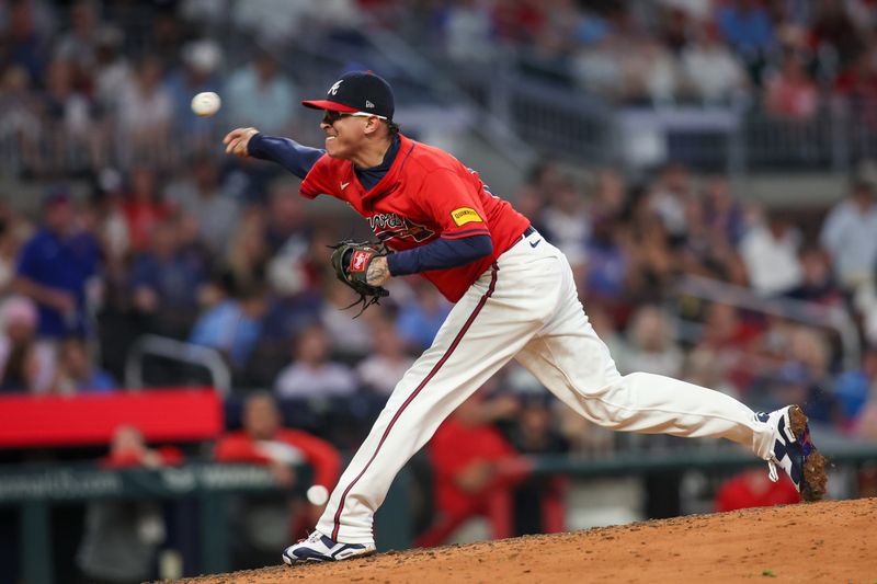 Jul 5, 2024; Atlanta, Georgia, USA; Atlanta Braves relief pitcher Jesse Chavez (60) throws against the Philadelphia Phillies in the seventh inning at Truist Park. Mandatory Credit: Brett Davis-USA TODAY Sports
