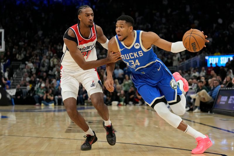 MILWAUKEE, WISCONSIN - NOVEMBER 30: Giannis Antetokounmpo #34 of the Milwaukee Bucks dribbles the ball against Alexandre Sarr #20 of the Washington Wizards during the first quarter of a game at Fiserv Forum on November 30, 2024 in Milwaukee, Wisconsin. NOTE TO USER: User expressly acknowledges and agrees that, by downloading and or using this photograph, User is consenting to the terms and conditions of the Getty Images License Agreement. (Photo by Patrick McDermott/Getty Images)