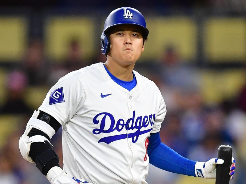 Apr 3, 2024; Los Angeles, California, USA; Los Angeles Dodgers designated hitter Shohei Ohtani (17) reacts after striking out against the San Francisco Giants during the first inning at Dodger Stadium. Mandatory Credit: Gary A. Vasquez-USA TODAY Sports