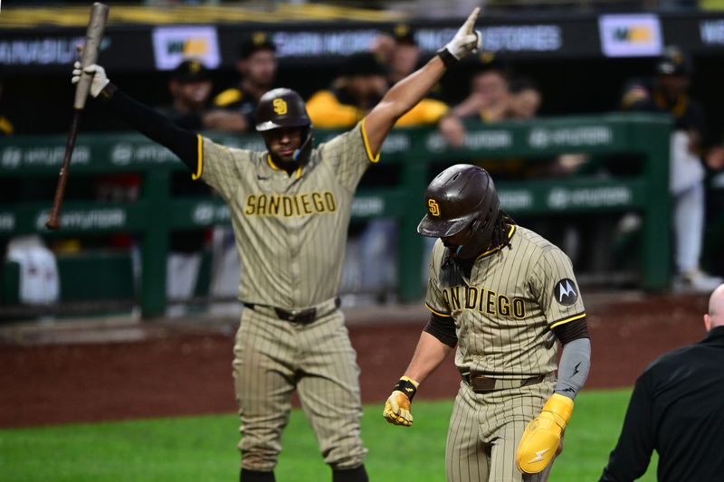 May 3, 2025; Pittsburgh, Pennsylvania, USA; San Diego Padres right fielder Fernando Tatis Jr. (23) celebrates after scoring a run after a wild pitch by Pittsburgh Pirates relief pitcher David Bednar (51) during the ninth inning at PNC Park. Mandatory Credit: David Dermer-Imagn Images