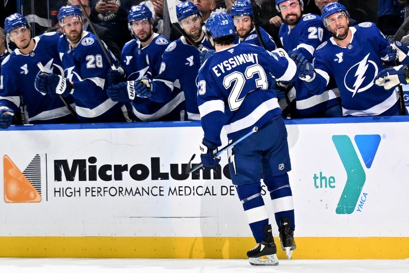 Feb 25, 2025; Tampa, Florida, USA ; Tampa Bay Lightning center Michael Eyssimont (23) celebrates with his teammates after scoring a goal  in the first period against the Edmonton Oilers  at Amalie Arena. Mandatory Credit: Jonathan Dyer-Imagn Images