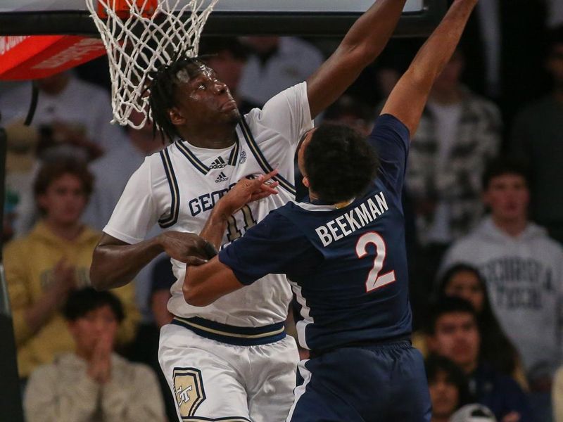 Jan 20, 2024; Atlanta, Georgia, USA; Georgia Tech Yellow Jackets forward Baye Ndongo (11) defends Virginia Cavaliers guard Reece Beekman (2) in the second half at McCamish Pavilion. Mandatory Credit: Brett Davis-USA TODAY Sports
