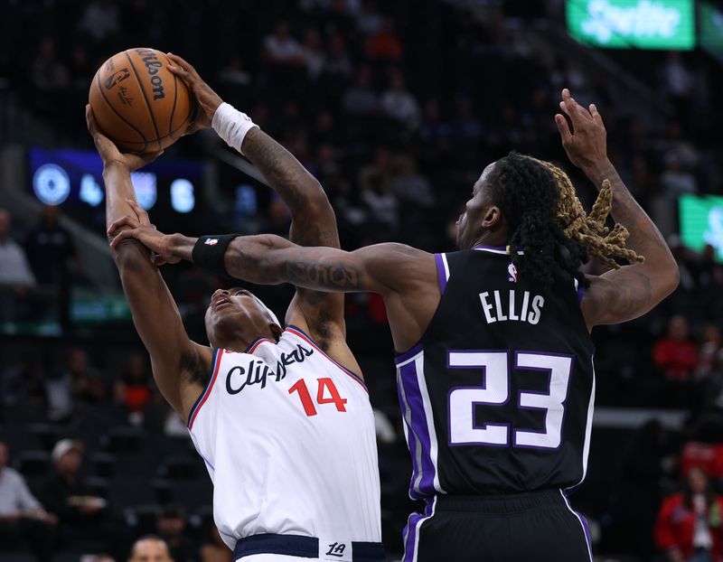 INGLEWOOD, CALIFORNIA - OCTOBER 17: Terance Mann #14 of the LA Clippers reacts as he is fouled on his shot by Keon Ellis #23 of the Sacramento Kings during the first half in a pre-season game at Intuit Dome on October 17, 2024 in Inglewood, California. (Photo by Harry How/Getty Images)