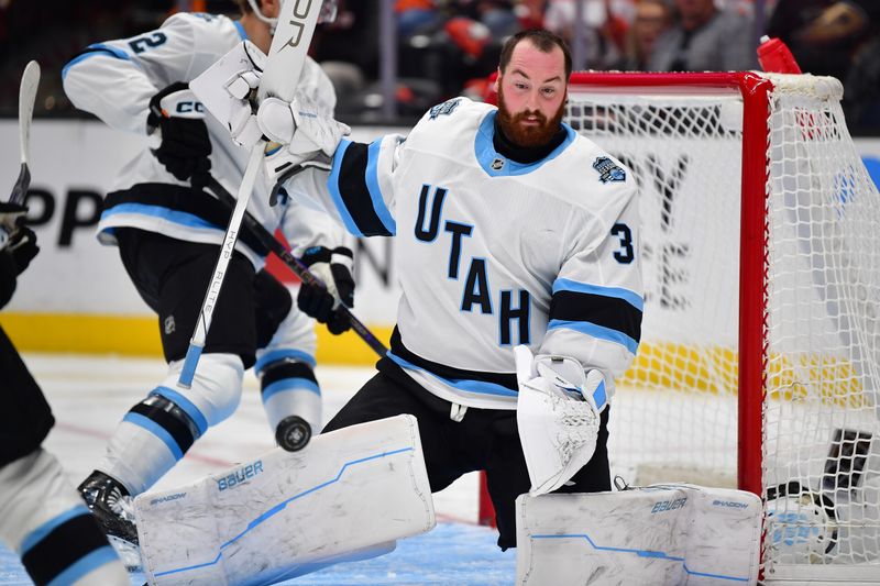 Oct 16, 2024; Anaheim, California, USA; Utah Hockey Club goaltender Connor Ingram (39) loses his helmet after blocking a shot against the Anaheim Ducks during the second period at Honda Center. Mandatory Credit: Gary A. Vasquez-Imagn Images