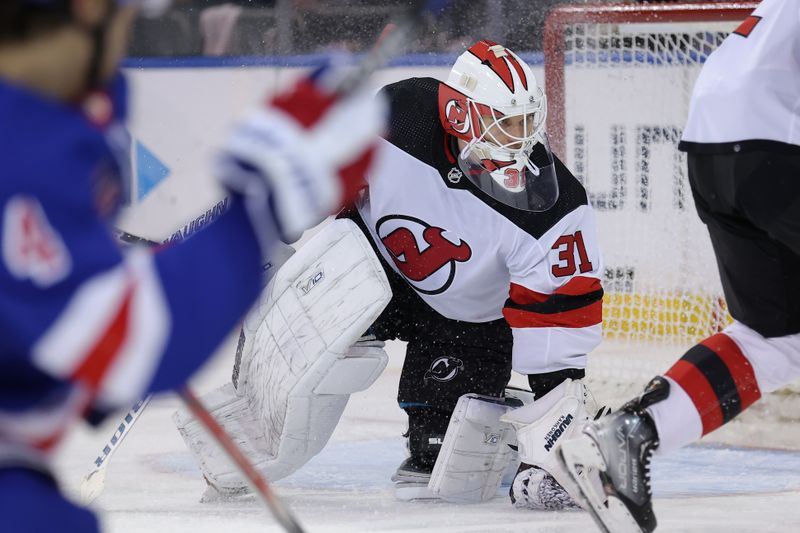 Mar 11, 2024; New York, New York, USA; New Jersey Devils goaltender Kaapo Kahkonen (31) tends net against the New York Rangers during the third period at Madison Square Garden. Mandatory Credit: Brad Penner-USA TODAY Sports