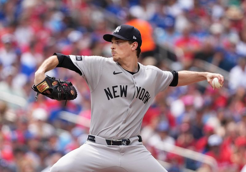 Jul 1, 2025; Toronto, Ontario, CAN; New York Yankees starting pitcher Max Fried (54) throws a pitch against the Toronto Blue Jays during the first inning at Rogers Centre. Mandatory Credit: Nick Turchiaro-Imagn Images