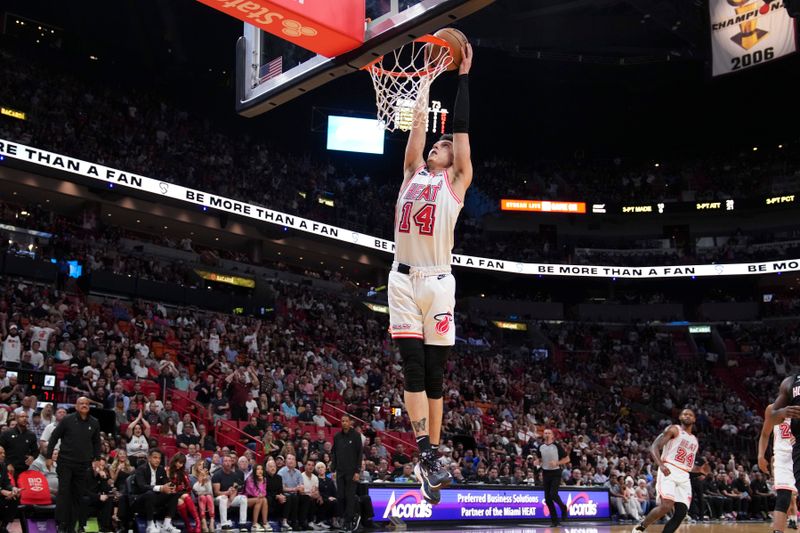 MIAMI, FLORIDA - FEBRUARY 10: Tyler Herro #14 of the Miami Heat dunks the basketball during the second half against the Houston Rockets at Miami-Dade Arena on February 10, 2023 in Miami, Florida. NOTE TO USER: User expressly acknowledges and agrees that,? by downloading and or using this photograph,? User is consenting to the terms and conditions of the Getty Images License Agreement. (Photo by Eric Espada/Getty Images)