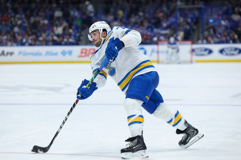 Dec 22, 2025; Tampa, Florida, USA; St. Louis Blues defenseman Justin Faulk (72) shoots the puck against the Tampa Bay Lightning in the second period at Benchmark International Arena. Mandatory Credit: Nathan Ray Seebeck-Imagn Images