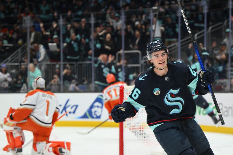 Oct 9, 2025; Seattle, Washington, USA; Seattle Kraken center Ryan Winterton (26) celebrates after a goal scored by Seattle Kraken left wing Mason Marchment (27) (not pictured) during the second period against the Anaheim Ducks at Climate Pledge Arena. Mandatory Credit: Steven Bisig-Imagn Images