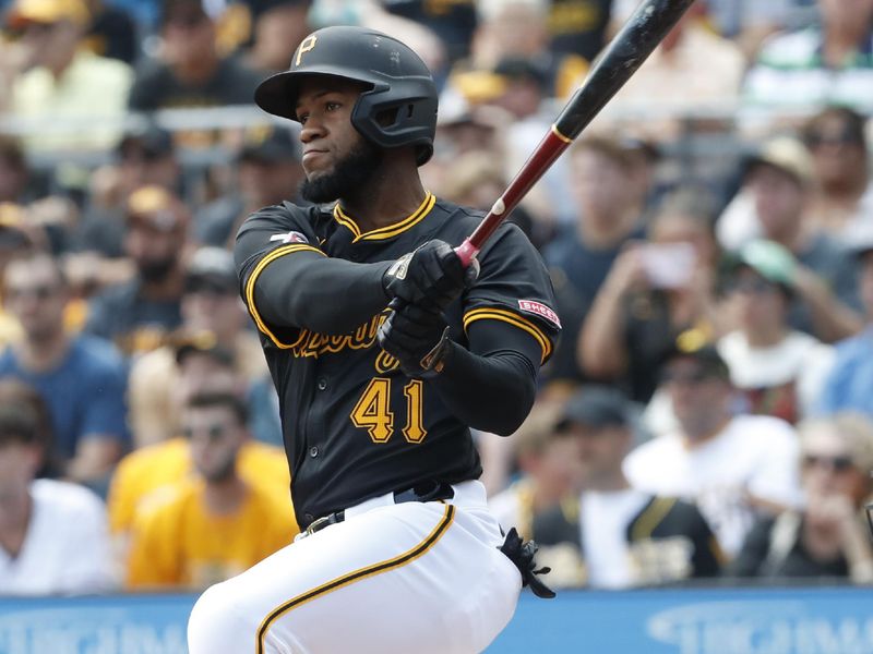 Aug 4, 2024; Pittsburgh, Pennsylvania, USA;  Pittsburgh Pirates right fielder Bryan De La Cruz (41) hits an RBI single against the Arizona Diamondbacks during the first inning at PNC Park. Mandatory Credit: Charles LeClaire-USA TODAY Sports