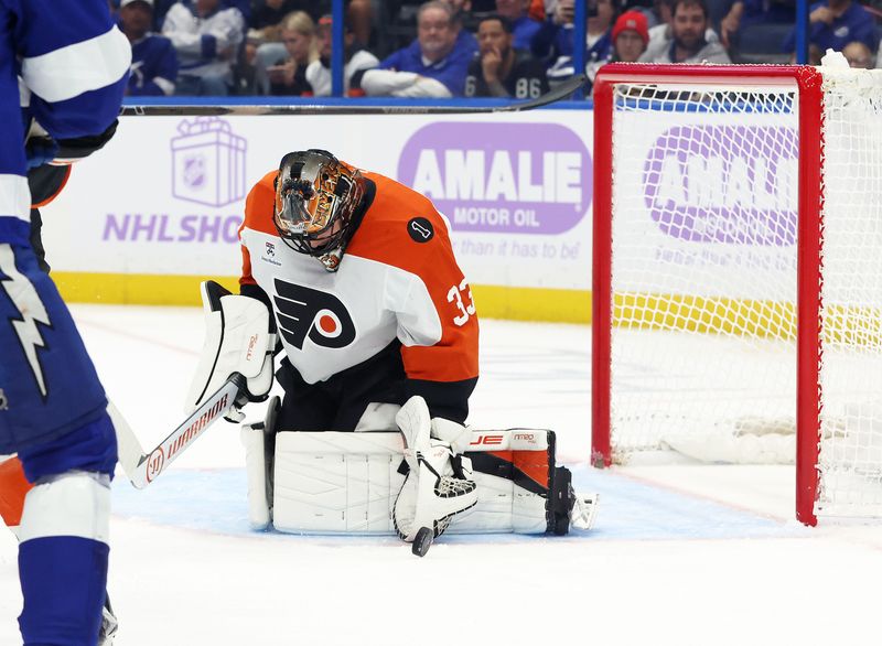 Nov 24, 2025; Tampa, Florida, USA; Philadelphia Flyers goaltender Samuel Ersson (33) makes a save against the Tampa Bay Lightning during the first period at Benchmark International Arena. Mandatory Credit: Kim Klement Neitzel-Imagn Images