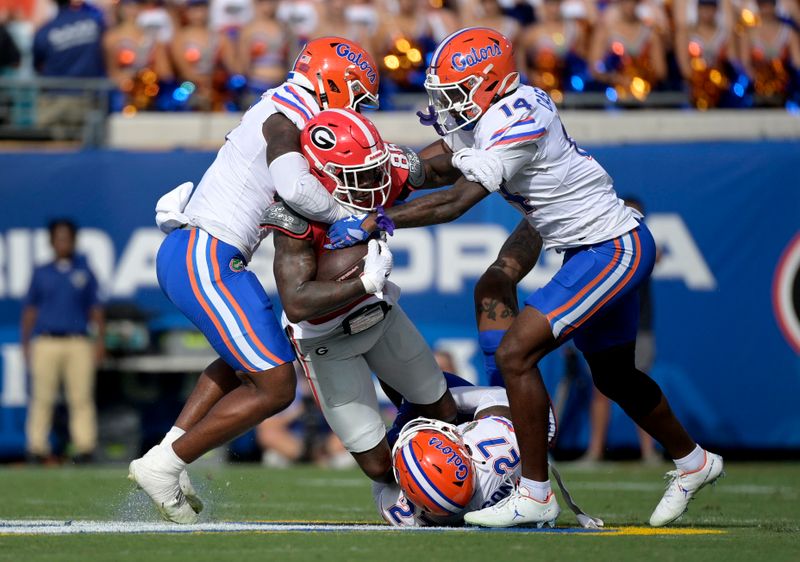 Nov 2, 2024; Jacksonville, Florida, USA; Georgia Bulldogs wide receiver Dillon Bell (86) is tackled against the Florida Gators during the first quarter at EverBank Stadium. Mandatory Credit: Melina Myers-Imagn Images