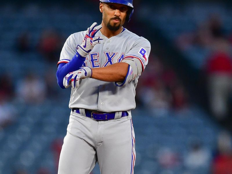 Sep 26, 2023; Anaheim, California, USA; Texas Rangers second baseman Marcus Semien (2) reacts after reaching second on a double against the Los Angeles Angels during the first inning at Angel Stadium. Mandatory Credit: Gary A. Vasquez-USA TODAY Sports