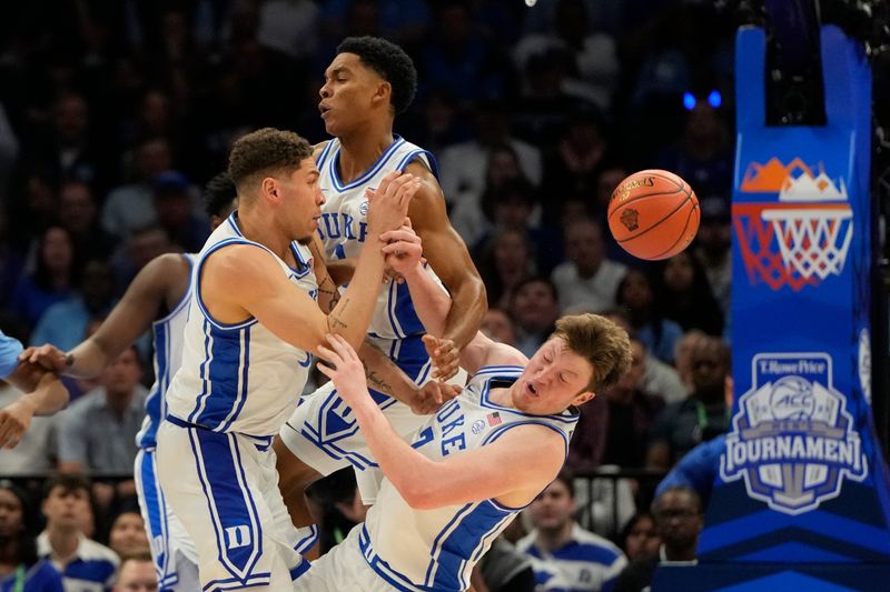 Mar 14, 2025; Charlotte, NC, USA; Duke Blue Devils forward Mason Gillis (18) and guards Caleb Foster (1) and Kon Knueppel (7) get tangled up going for the ball in the first half at Spectrum Center. Mandatory Credit: Bob Donnan-Imagn Images