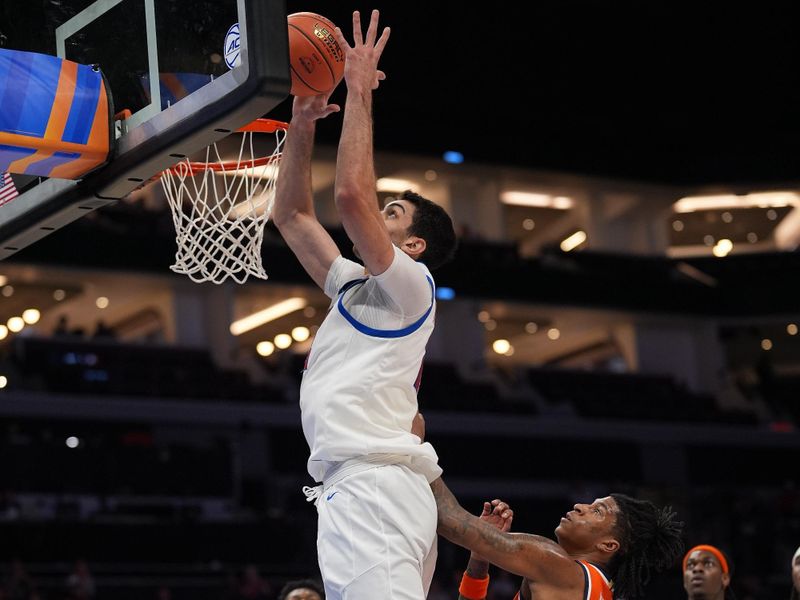 Mar 10, 2026; Charlotte, NC, USA;  Southern Methodist University Mustangs center Samet Yigitoglu (24) grabs a rebound during the first half against the Syracuse Orange at Spectrum Center. Mandatory Credit: Jim Dedmon-Imagn Images