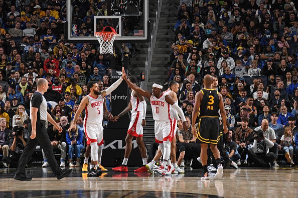 SAN FRANCISCO, CA - NOVEMBER 20: Fred VanVleet #5 and Aaron Holiday #0 of the Houston Rockets high five during the game against the Golden State Warriors on November 20, 2023 at Chase Center in San Francisco, California. NOTE TO USER: User expressly acknowledges and agrees that, by downloading and or using this photograph, user is consenting to the terms and conditions of Getty Images License Agreement. Mandatory Copyright Notice: Copyright 2023 NBAE (Photo by Noah Graham/NBAE via Getty Images)