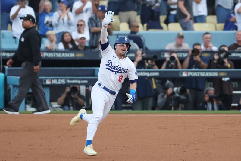 Oct 11, 2024; Los Angeles, California, USA; Los Angeles Dodgers third baseman Enrique Hernandez (8) runs after hitting a solo home run in the second inning against the San Diego Padres during game five of the NLDS for the 2024 MLB Playoffs at Dodger Stadium. Mandatory Credit: Kiyoshi Mio-Imagn Images