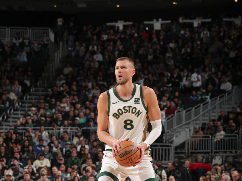 MILWAUKEE, WI - JANUARY 11:  Kristaps Porzingis #8 of the Boston Celtics handles the ball during the game  on January 11, 2024 at the Fiserv Forum Center in Milwaukee, Wisconsin. NOTE TO USER: User expressly acknowledges and agrees that, by downloading and or using this Photograph, user is consenting to the terms and conditions of the Getty Images License Agreement. Mandatory Copyright Notice: Copyright 2024 NBAE (Photo by Gary Dineen/NBAE via Getty Images).