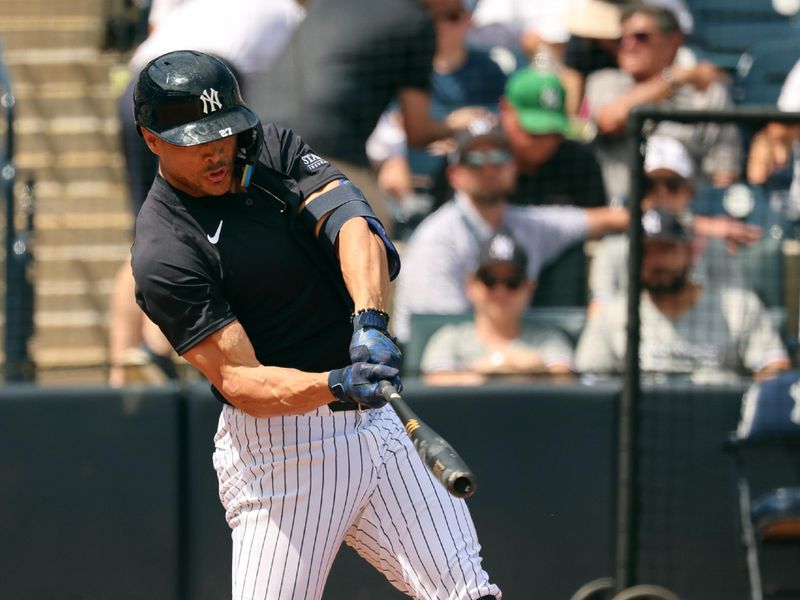 Mar 13, 2024; Tampa, Florida, USA; New York Yankees designated hitter Giancarlo Stanton (27) singles during the fourth inning against the Boston Red Sox  at George M. Steinbrenner Field. Mandatory Credit: Kim Klement Neitzel-USA TODAY Sports