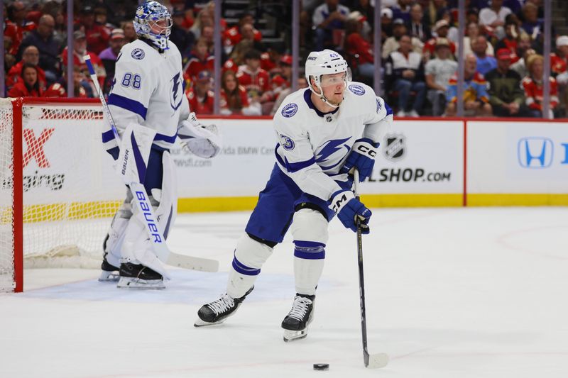 Apr 23, 2024; Sunrise, Florida, USA; Tampa Bay Lightning defenseman Darren Raddysh (43) moves the puck against the Florida Panthers during the second period in game two of the first round of the 2024 Stanley Cup Playoffs at Amerant Bank Arena. Mandatory Credit: Sam Navarro-USA TODAY Sports