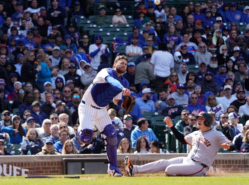 May 7, 2025; Chicago, Illinois, USA; Chicago Cubs catcher Carson Kelly (15) forces San Francisco Giants first base Wilmer Flores (41) out at home plate during the sixth inning at Wrigley Field. Mandatory Credit: David Banks-Imagn Images
